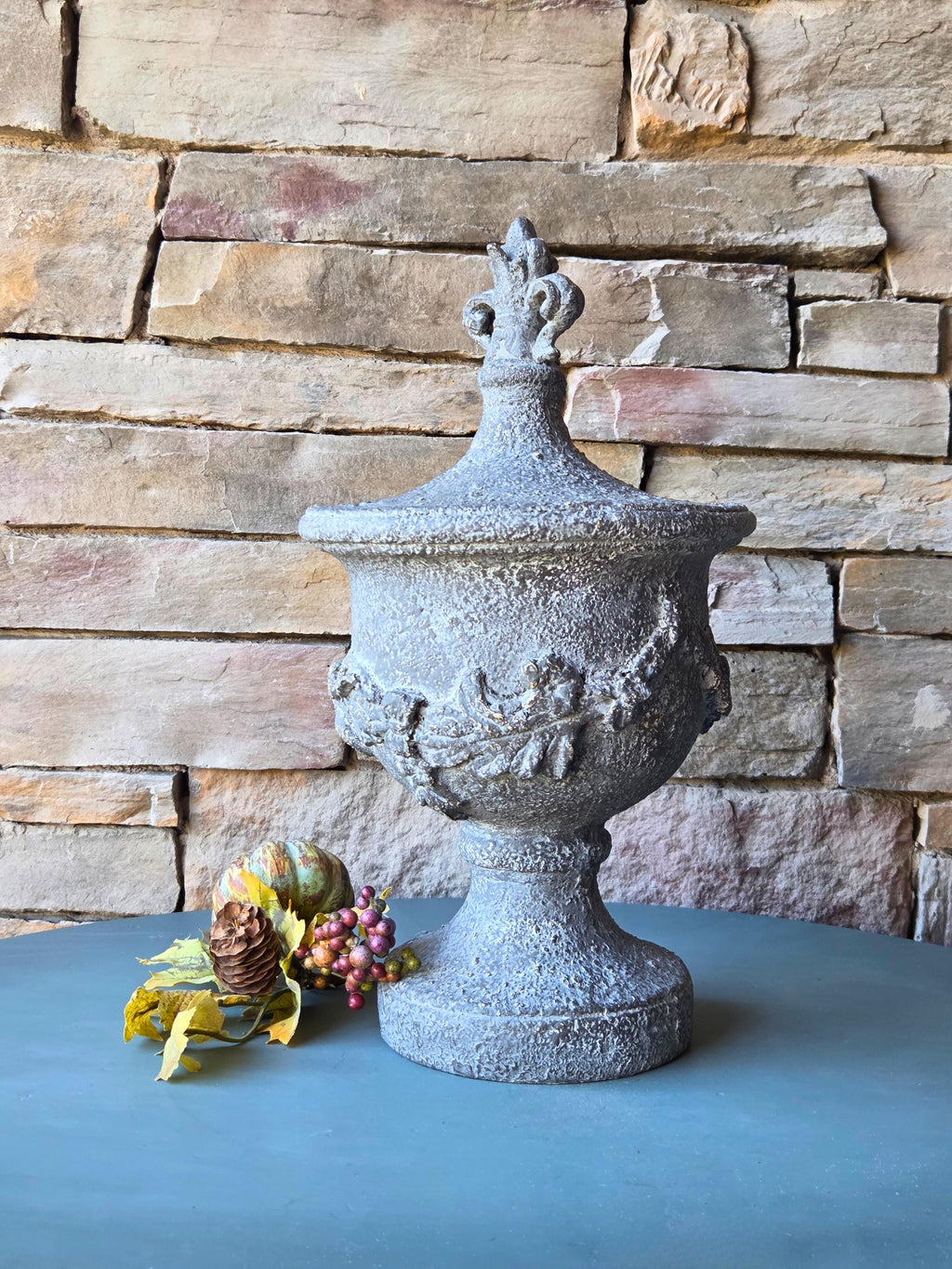 Decorative Resin Urn with Cherub Relief  16.5" Tall Classical Accent with Fleur-de-Lis Finial